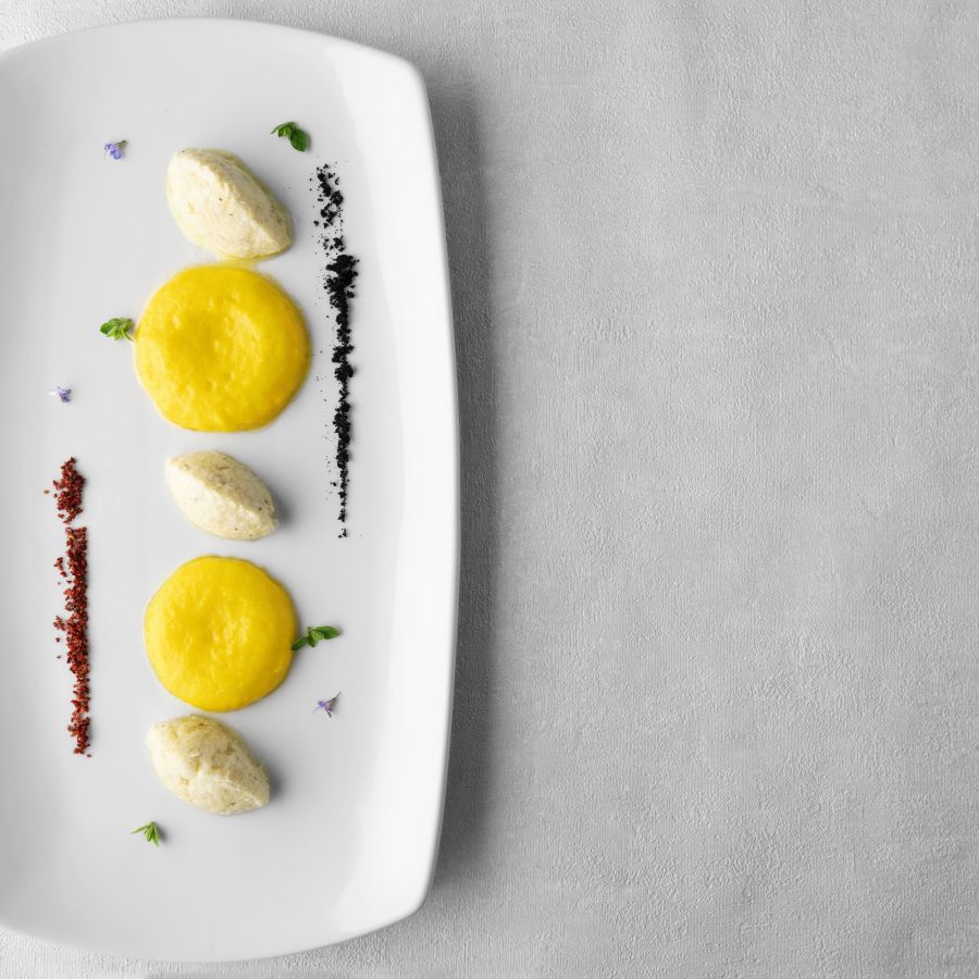 Saffron-flavoured creamed salt cod, olive powder and crusco peppers