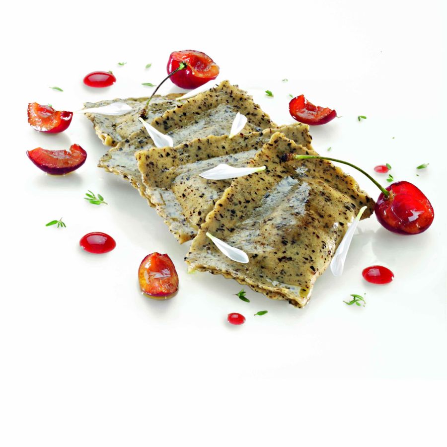 Rustic tortellacci with roebuck, cherries, and taleggio cream