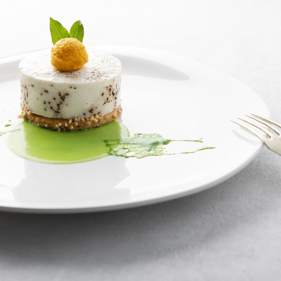 Cheesecake “cacio e pepe” on salted peanut biscuit, candied pumpkin sphere, savoy cabbage fondant and kale