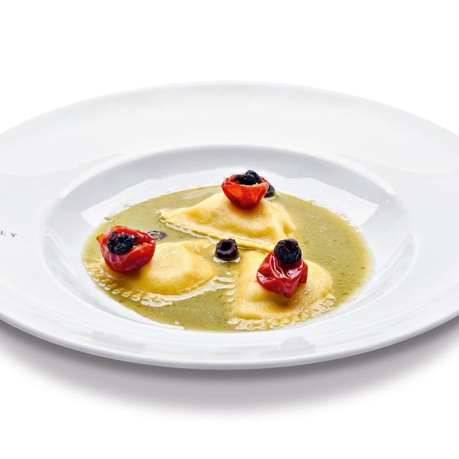 Raviolotti al baccalà,  scarola, ciliegino semi candito e olive nere disidratate